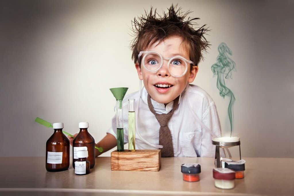 A boy doing a science experiment at a desk